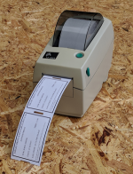 Image of Zebra printer with appointment cards being printed